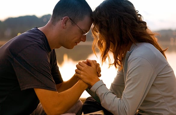 Couple Holding Hands and Praying | Pure Flix