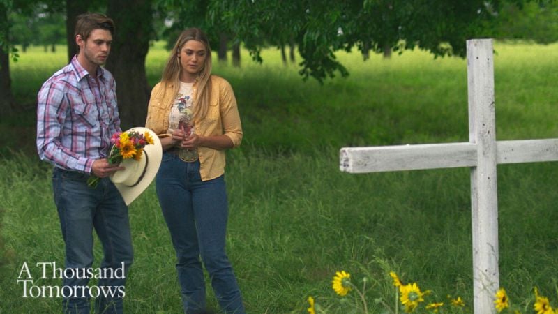 cody and ali at sister's grave with cross