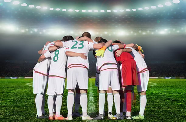players praying before a big game