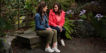 hannah and friend sitting on bench