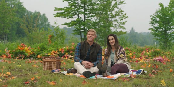 couple having a picnic surrounded by fall leaves a harvest homecoming original movie