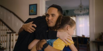 mason hugging two children mr manhattan