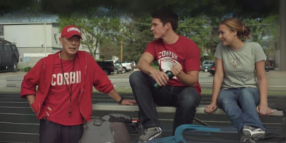 23 blast teens sitting in football bleachers with coach