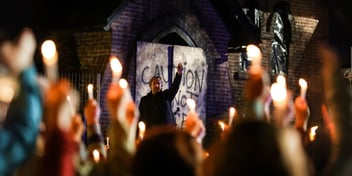 reverend dave candle scene in a light in darkness