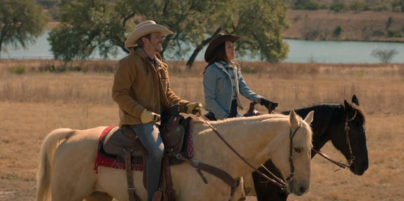 two riders on horses moonrise
