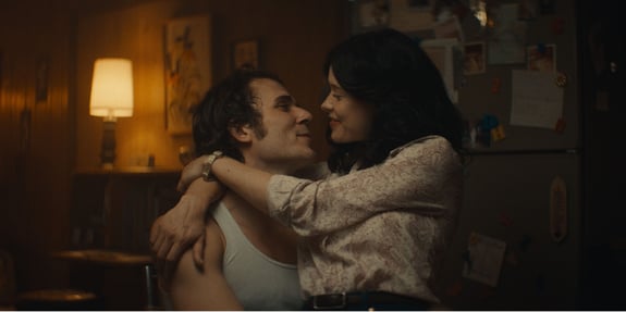 kay and phil hugging and looking at each other in the blind