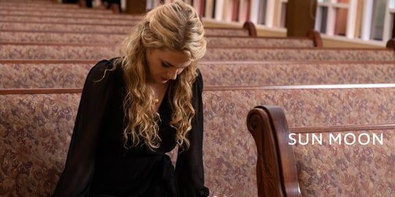 kelsey praying in pew sun moon pure flix blog header