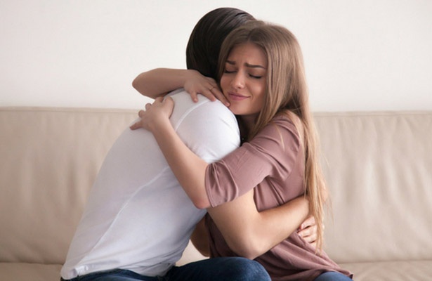 two people hugging after forigiving