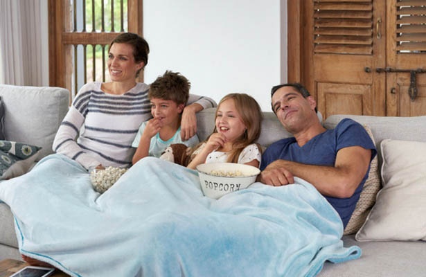family-watching-tv-on-couch-blog-header